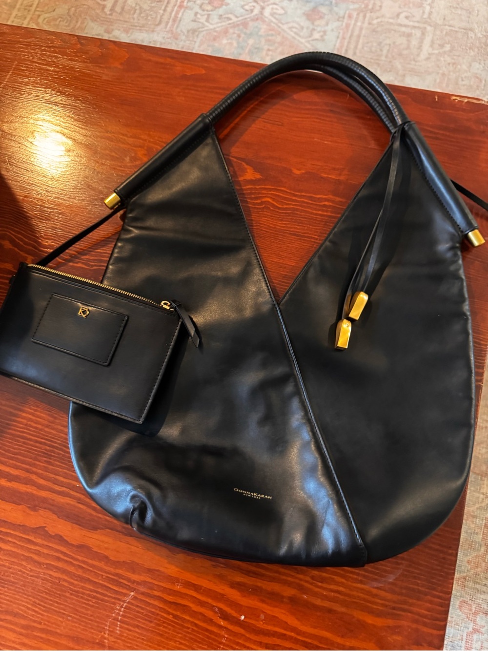 Donna Karen Black Leather Hobo Bag with Gold Accents - Designer